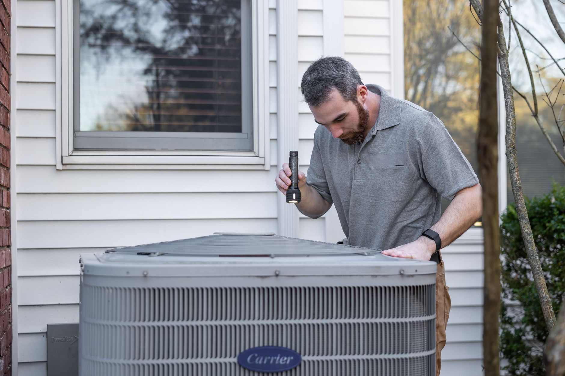 HVAC technician arriving at a residential service call
