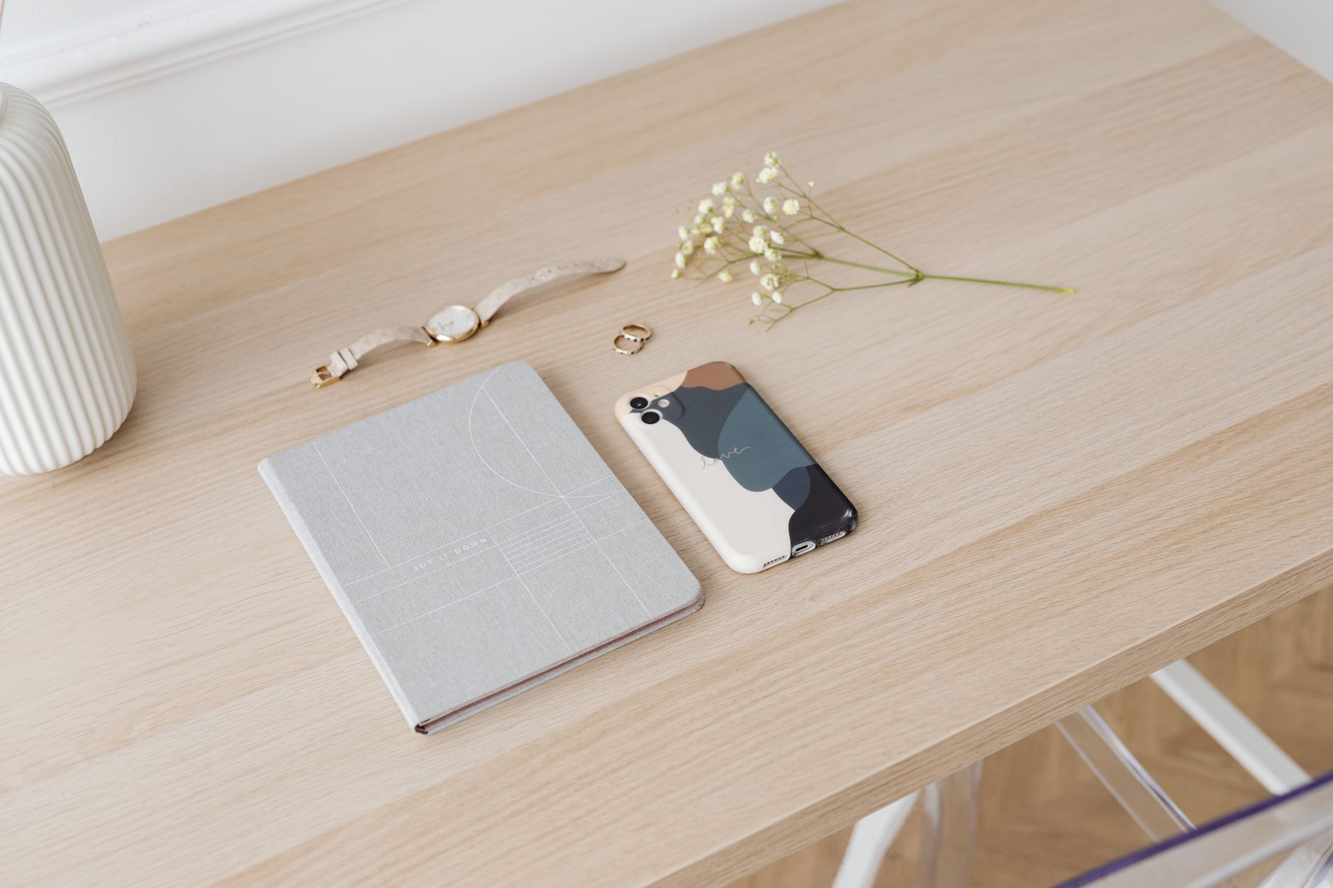 Business phone ringing on a desk beside a notepad, representing an inbound sales inquiry