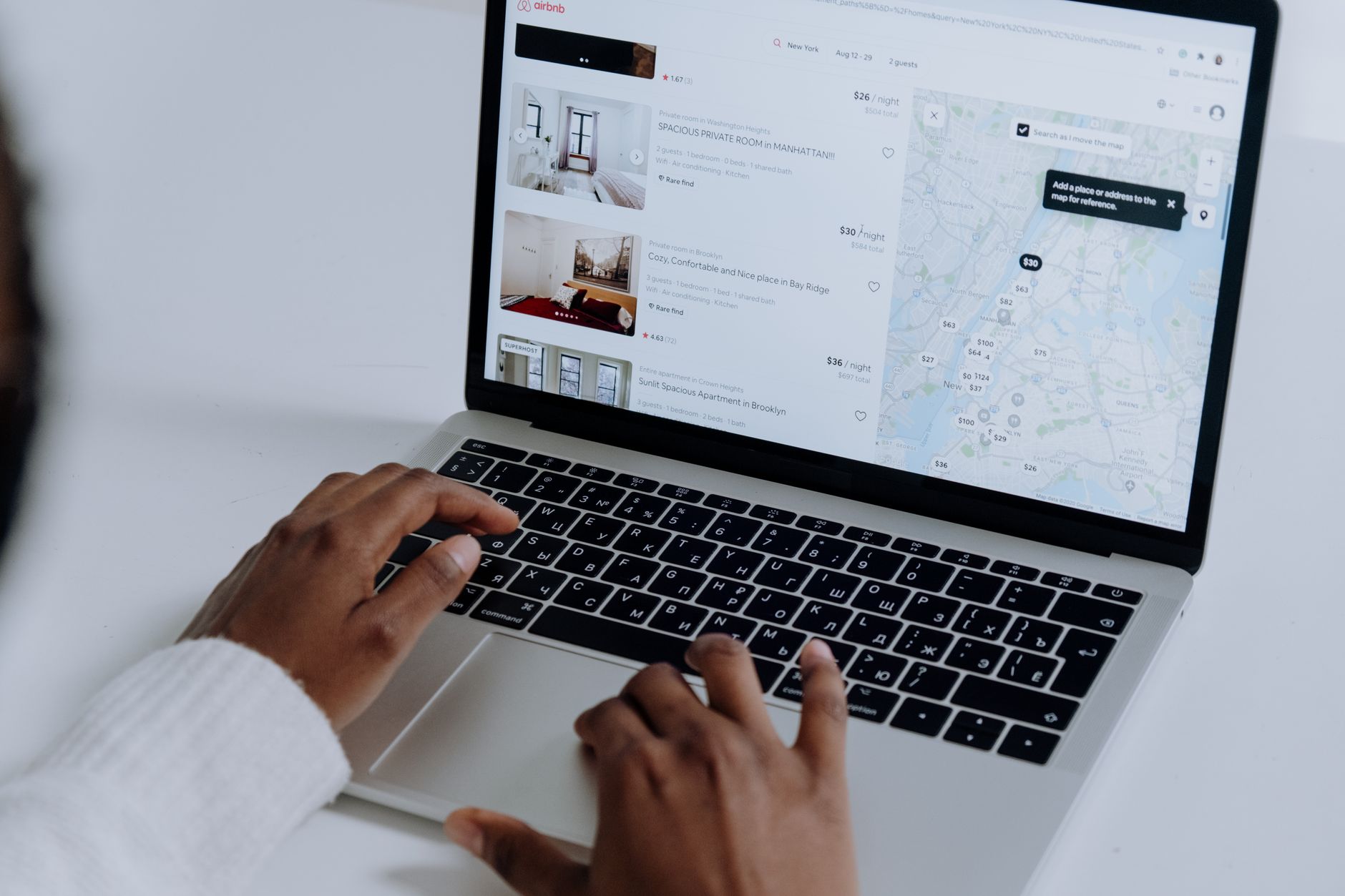 Airbnb host reviewing guest booking details and call notes on a laptop